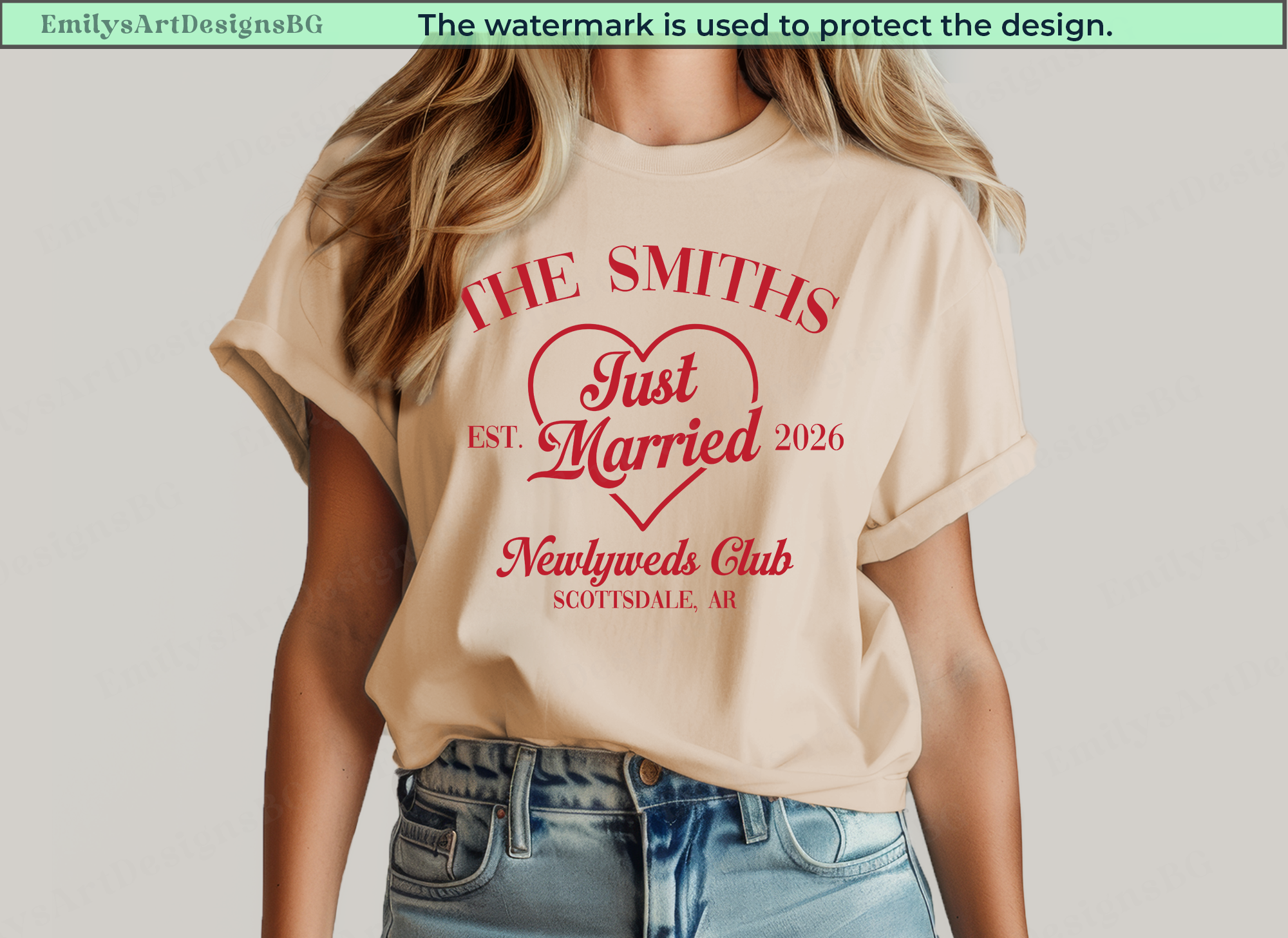 Beige t-shirt with red text and design, worn by a person on a plain background