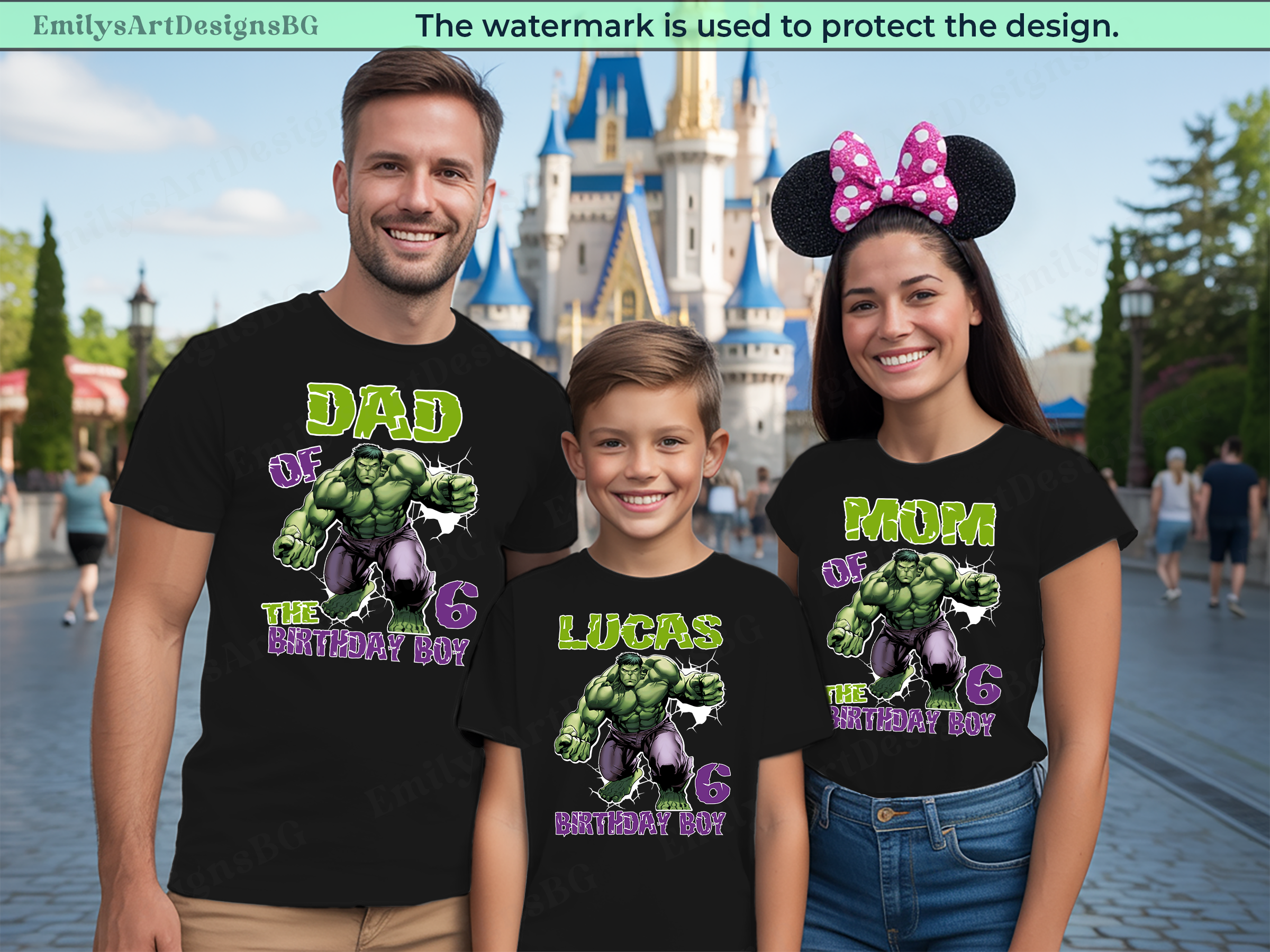 Family wearing matching t-shirts with superhero design in front of a castle.