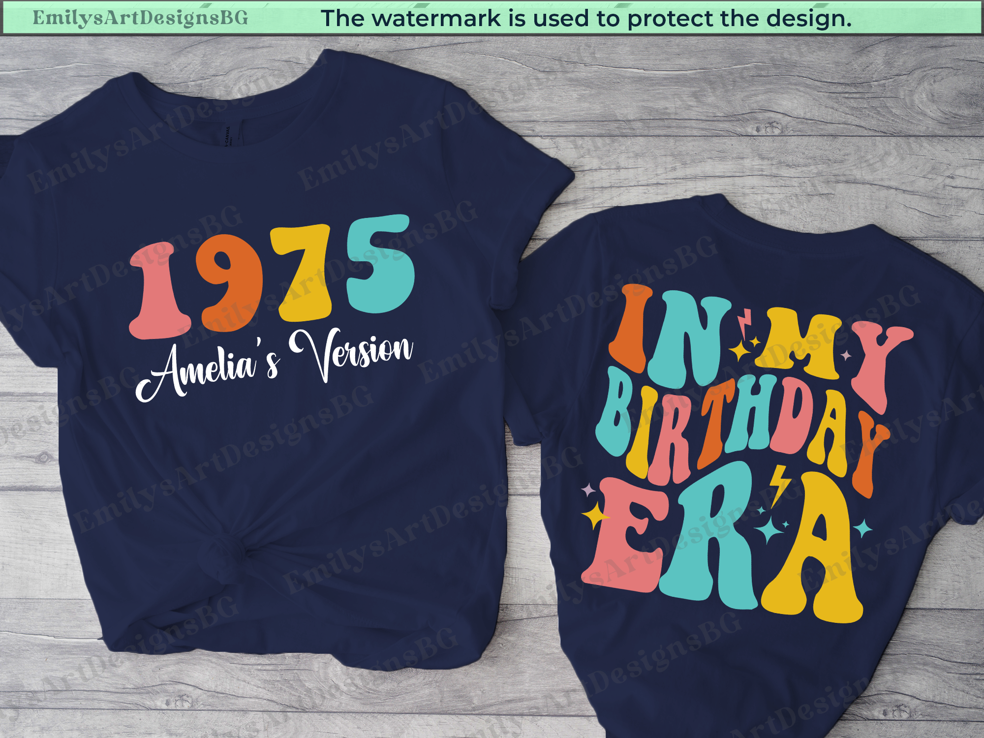 Two navy blue t-shirts with colorful text on a wooden surface.