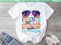 White t-shirt with 'Friends that cruise together last forever' design on a wooden surface with jeans and sneakers.