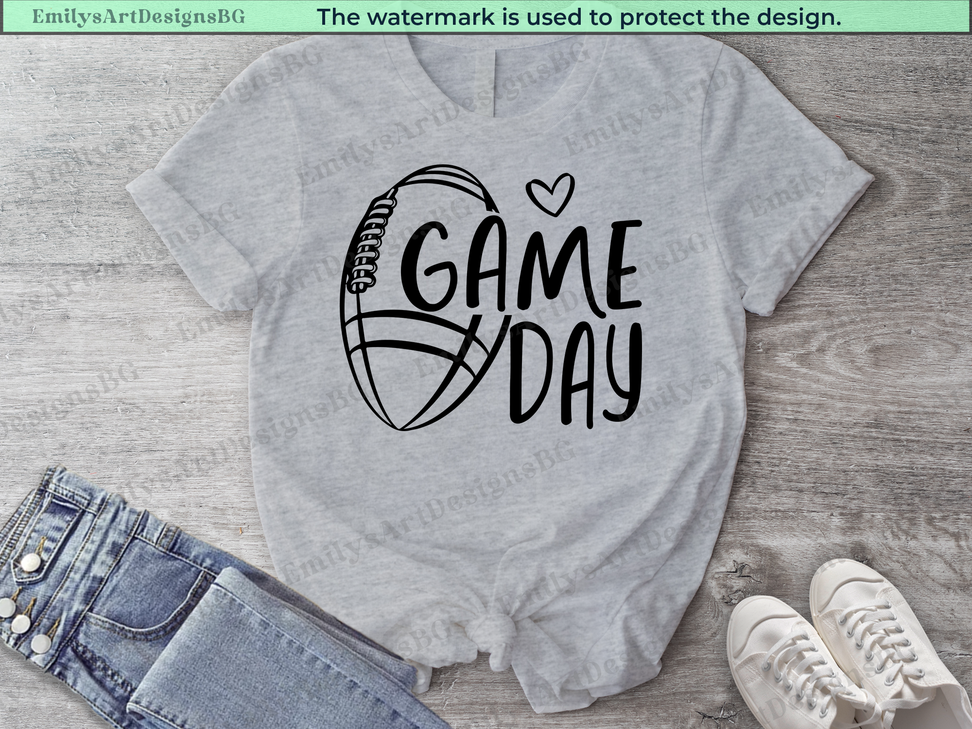 Gray t-shirt with 'Game Day' and basketball graphic on a wooden surface with jeans and sneakers.