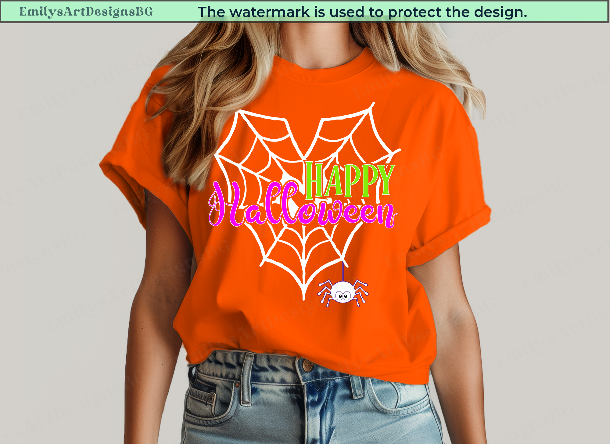 Person wearing an orange Halloween-themed t-shirt with a spider web design.