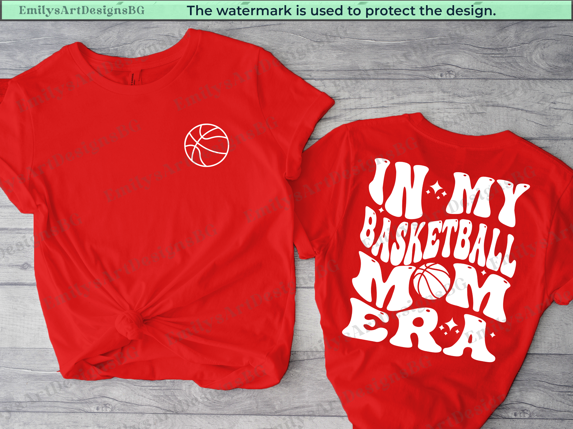 Two red t-shirts with a basketball design and text on a wooden surface.