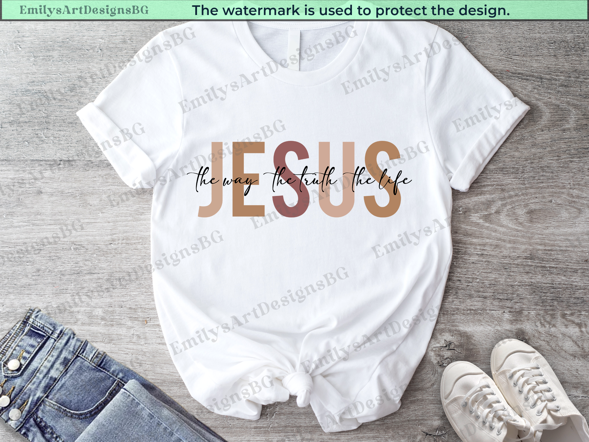White baby romper with 'Jesus the way, the truth, the life' text on a wooden surface.