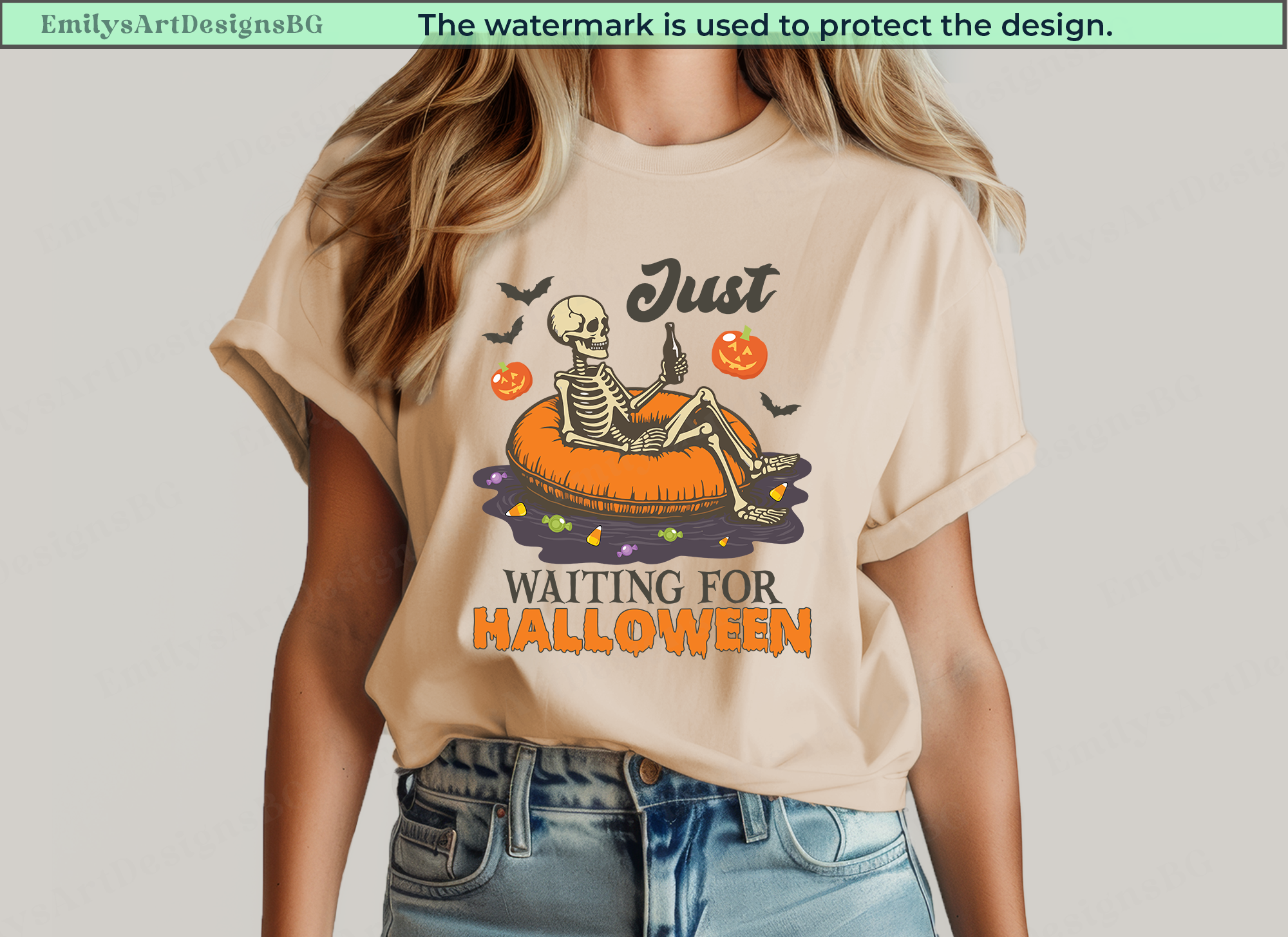 Beige t-shirt with Halloween-themed design featuring a skeleton and text, worn by a person.