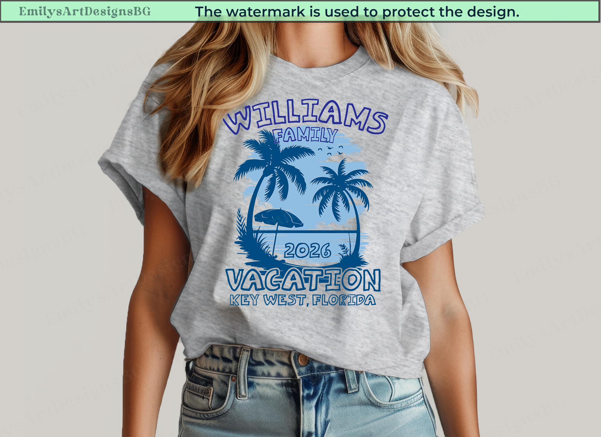 Gray t-shirt with blue 'Williams Family Vacation' design worn by a person on a plain background