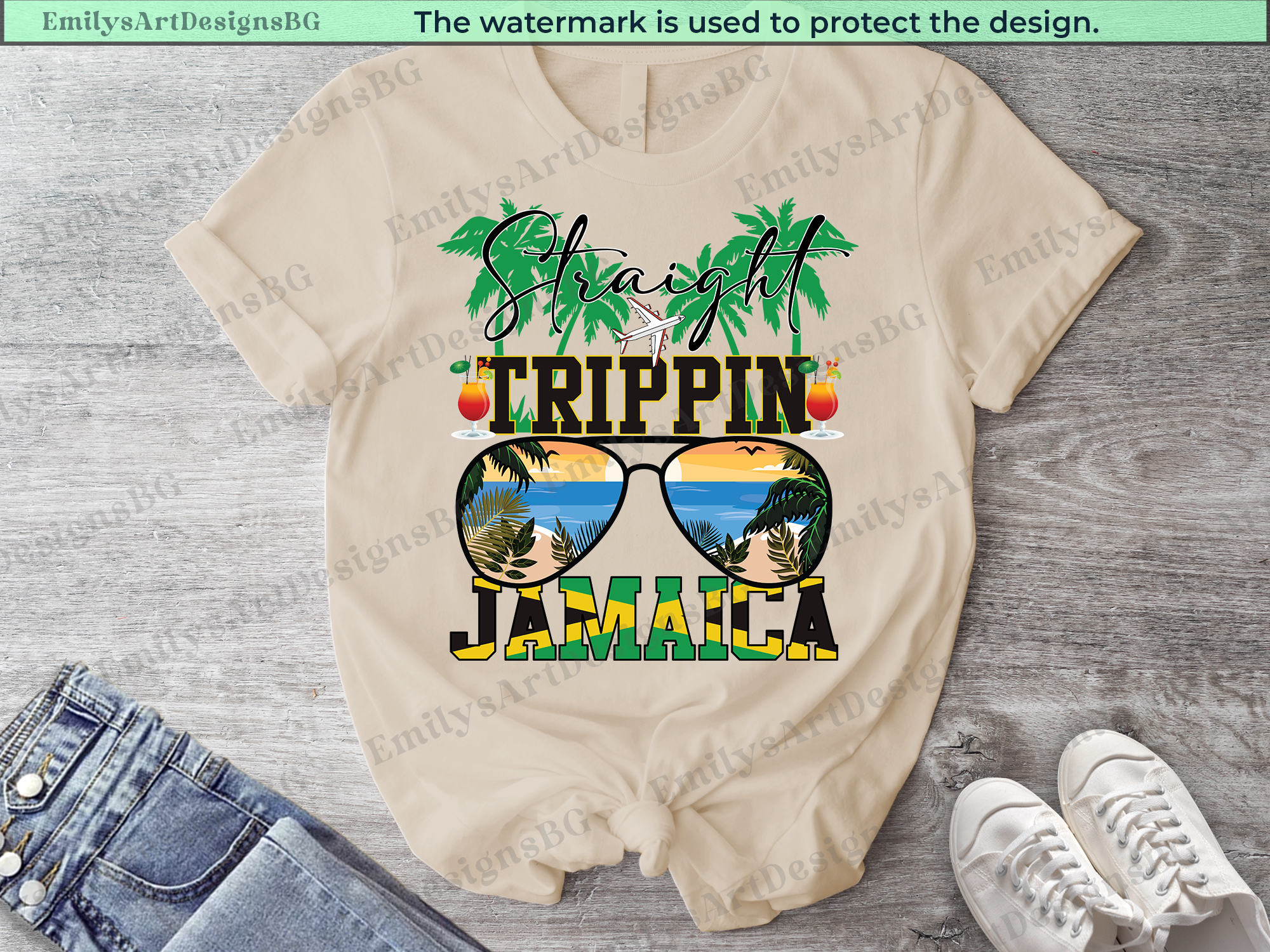 Beige t-shirt with 'Straight Trippin Jamaica' design on a wooden surface with jeans and sneakers.